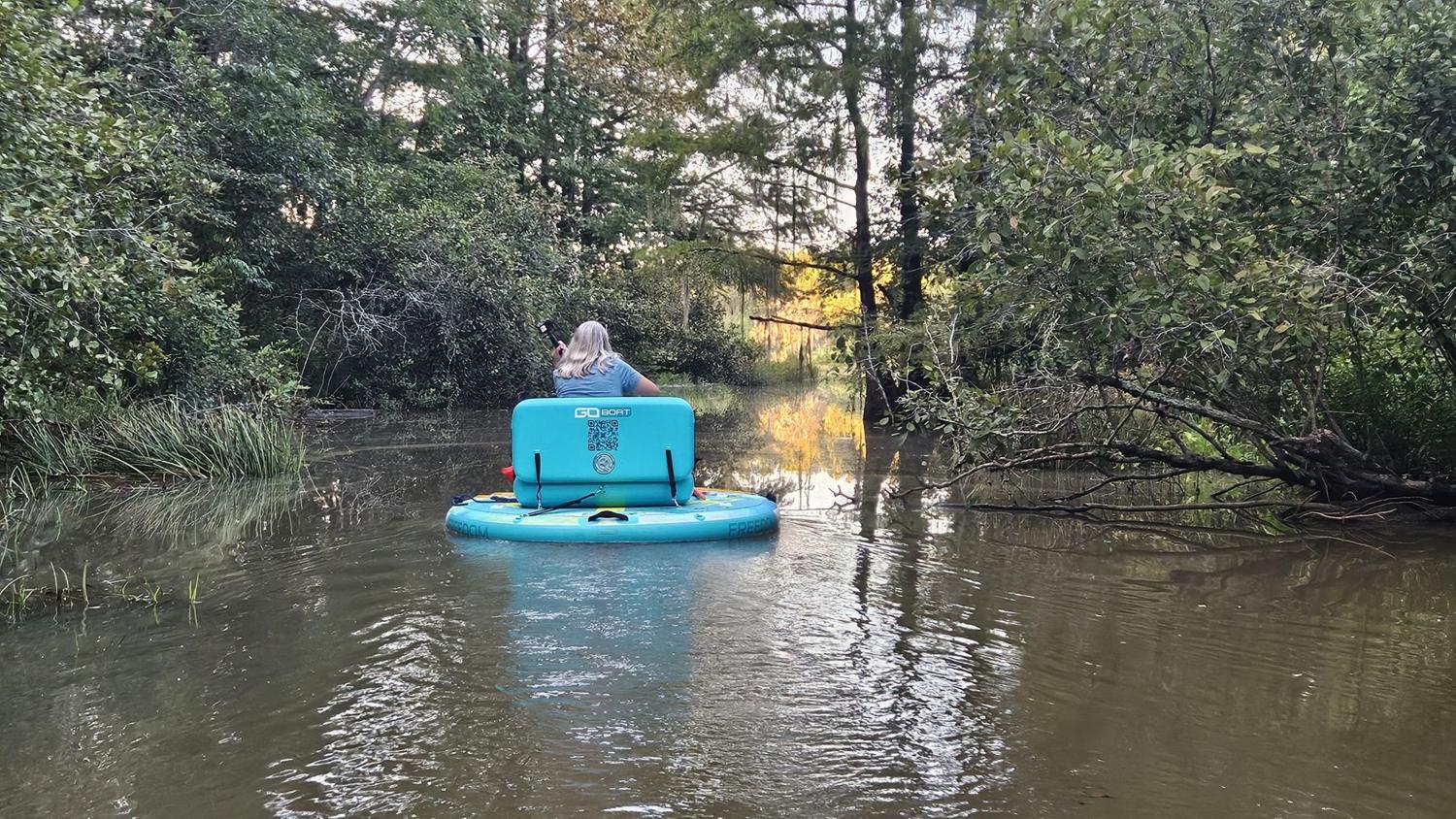 A guest on a Go Boat in a quiet cove of Gantt Lake