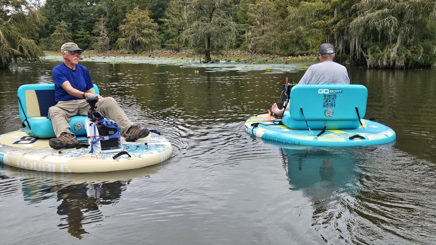 Friends relaxing on Go Boats on Gantt Lake