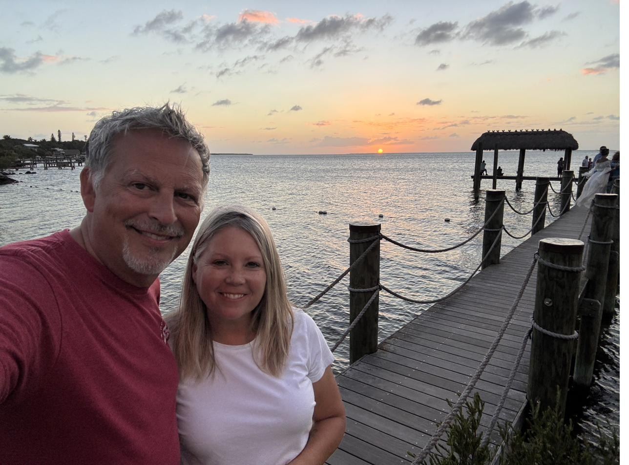 Todd and Sheila, owners of Cypress Landing, on the dock at sunset